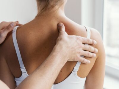 male-osteopathic-therapist-checking-female-patient-s-upper-spine